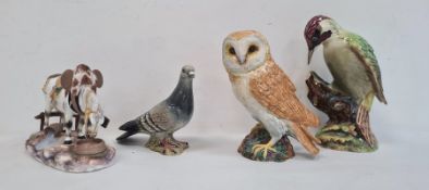Three various Beswick ceramic model birds to include a woodpecker, an owl and a wood pigeon and a