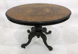 Victorian walnut looe table with moulded edge, on turned and carved central column to four