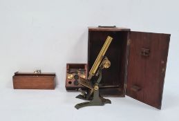 Metal and brass microscope in wooden box and a bone and ivory nine-spot domino set in 19th century