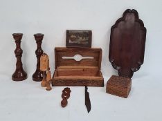 Pair of turned wooden candlesticks, a carved wooden box, another, a wallet depicting pyramids to