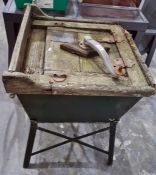 Vintage wooden and tin washing machine labelled 'The Housewives Darling Washer' on metal green