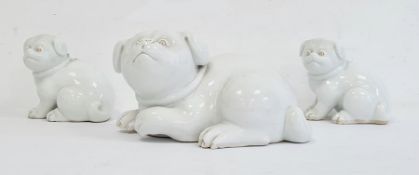 Three various Japanese Meiji period Hirado white glazed porcelain models of Akita puppies, each