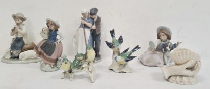 Two various Lladro figures, one with a girl carrying a basket the other seated with a dog, a Nao