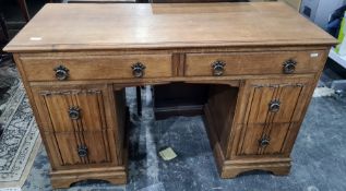 20th century oak desk, the rectangular top with applied moulded edge above six assorted drawers,