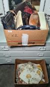 Box of assorted handbags and a box of table linen, tea cosys, etc