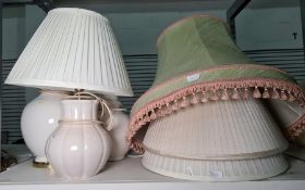 Three cream ceramic table lamps, not matching and four pleated shades of various sizes (7)