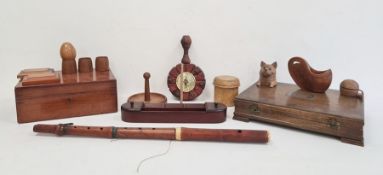 Carved wooden inkwell in the form of a cat with glass eyes, various wooden eggcups, a desk tidy with