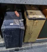 Large vintage travelling suitcase and another containing assorted table and other linen (2)