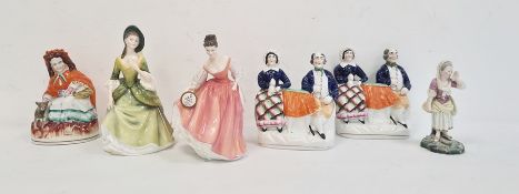 Pair of 19th century Staffordshire pottery flatback figures of lady and gentleman seated, another