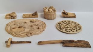 Small collection of antique Japanese carved ivory to include basket of fruit and other pieces on