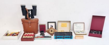 Pair of binoculars in leather case, a pocket chess and draughts, candle wax sealing set, dominoes,