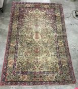 Cream ground Persian rug with Tree of Life decoration, with pink ground upper spandrels, on a