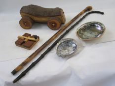 Two walking canes, a wooden turning toy labelled to reverse 'Chris Butcher Ghost Mill', two shells