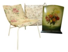 20th century vinyl chair with floral upholstery, a metal fire-screen with floral decoration of