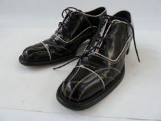 Prada brogues in black leather with white leather trim detail, size 37, in original box