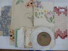 Assorted embroidered table linen to include a large embroidered linen tablecloth/throw with orange