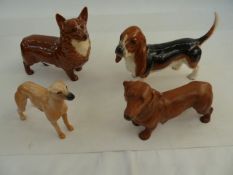 Beswick model of a corgi, a Beswick model of a bassett hound, a dachshund and a lurcher (4)