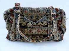 Cut velvet tapestry bag labelled Carpet Bags with zip fastening and double-handled strap with