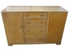 20th century oak sideboard, probably by Gordon Russell, with four central drawers, one bearing
