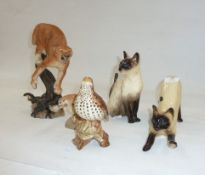 Model of a Siamese cat, another seated, a Beswick model of a Thrush, a 'The Defender' hand-painted