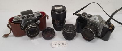 Exa camera with Meyer Optic lens, a mini Rexina projector, a Photax-Paragon 1:2.8 camera lens and