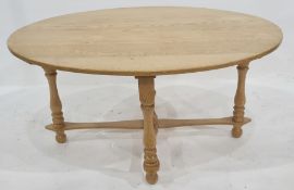 Modern oak oval coffee table on turned supports, stretchered base, 98cm wide