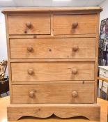 20th century pine chest of two short over three long drawers, on plinth base, 66W x 76H x 35.5D cm
