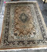 A Persian style rug central medallion foliate decoration borders  in dark brown and green, 213 x