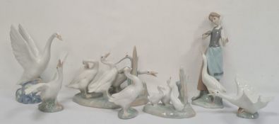 Lladro figure group of three ducks by Reeds, a Lladro duck about to take flight, two other model