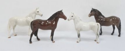 Four Beswick ceramic model ponies 