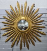 Large modern sunburst mirror, the central circular mirror approximately 28cm diameter, overall