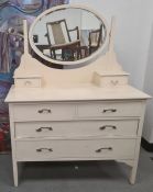 Cream painted dressing chest, the oval mirror above two short and two long drawers, on square