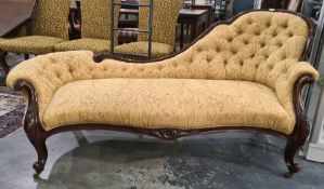 Victorian mahogany spoon-back chaise longue with yellow foliate buttonback upholstery, serpentine
