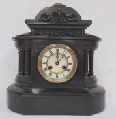 Black slate mantel clock with Roman numerals to the dial