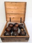 Set of eight early 20th century wooden lawn bowls with bone marking dots and a smaller turned wooden