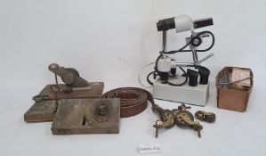 Two brass doorlocks and various castors, a box of  lead 