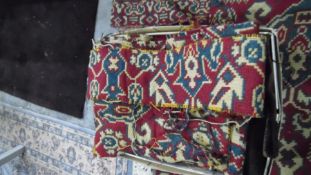 Heavily cut down rug, the red ground with allover foliate pattern, with alterations, notches, cut,