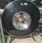 Large vintage circular, black and silver coloured metal , electric heater