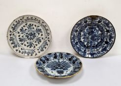 Antique circular blue and white Delft charger, floral decorated (repaired), marked B:P to base, 35cm