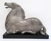 Silvered plaster model of a kneeling horse, on rectangular plinth, 40cm high