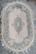 Chinese oval rug, cream ground with blue decoration