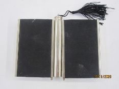 Early to mid-20th century chrome and fabric compact with central lipstick flanked by two hinged