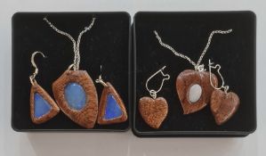 Pair of modern wood and opal pendant earrings, triangular with similar shield-shaped pendant, on