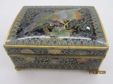 Cloisonne box, rectangular with slightly domed hinged lid, decorated with a phoenix within lappet