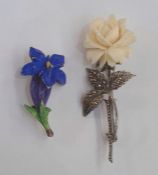 Marcasite and carved ivory rose brooch and a ceramic floral brooch (2)