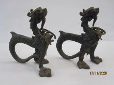Pair 19th century Asian cast metal model dragons with curved tails, 24cm high (2)