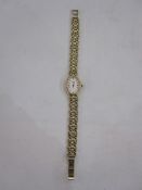 Modern lady's 9ct gold Rotary bracelet watch, the oval dial with baton markers and integral 9ct gold
