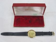 Gentleman's Omega De Ville strap watch, the circular dial with baton markers in gilt metal case with