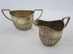 A Victorian silver two handled sugar bowl, angled fluted handles and fluted decoration to body,