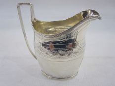 George III silver cream jug, probably by Christian Fuller, London 1799, of oval form with reeded